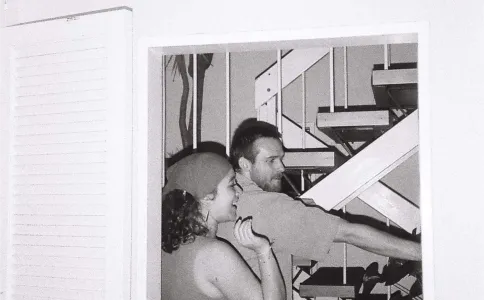 Black and white two people by staircase