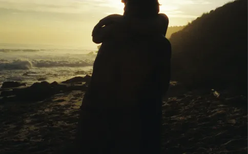 Silhouette girl at sunset